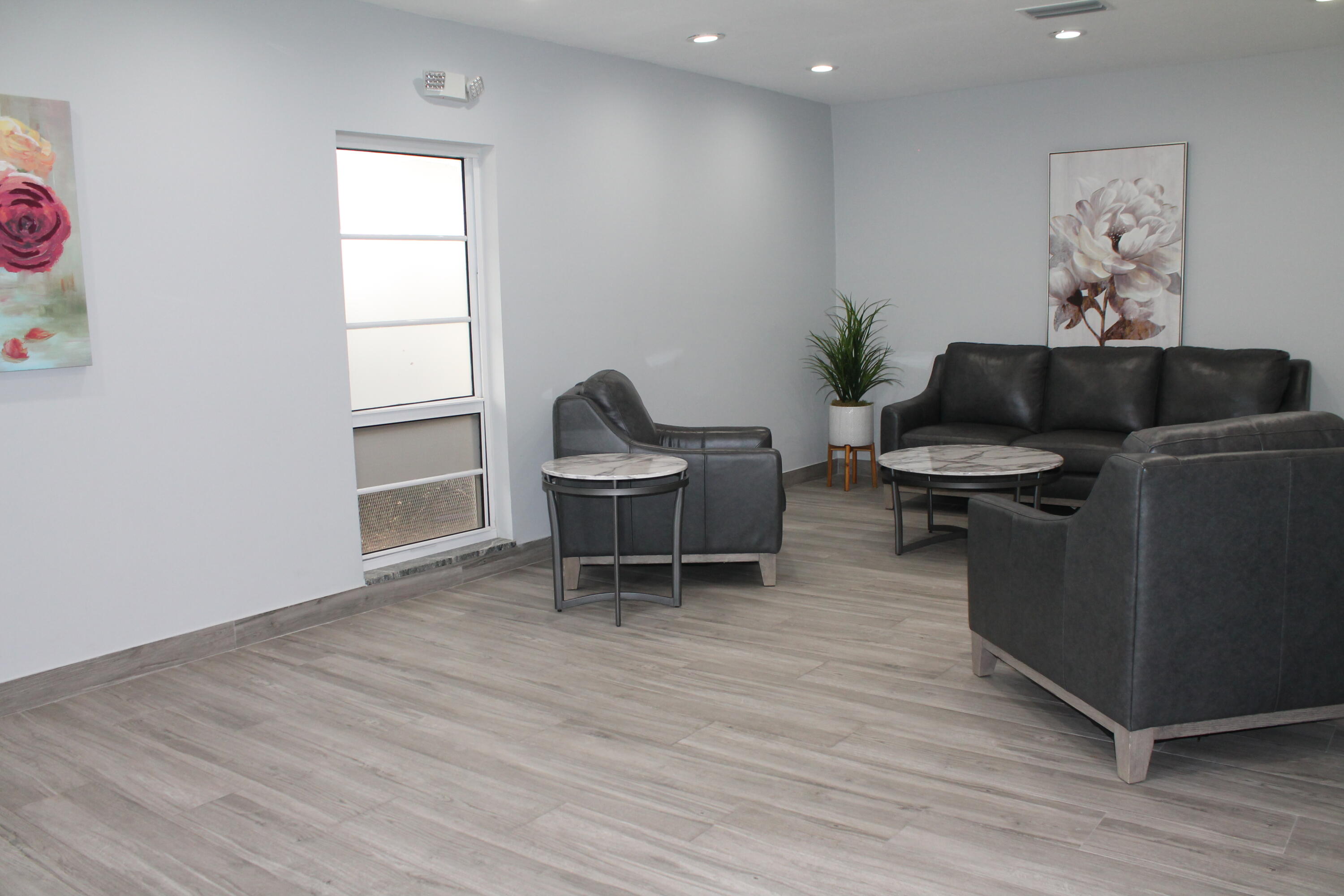 3520 Oaks Way, Unit 607 Pompano Beach, FL 33069 - Photo 42 of 46 a living room with furniture and a window