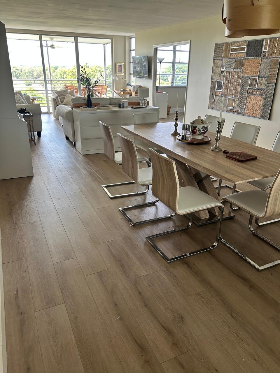 3520 Oaks Way, Unit 607 Pompano Beach, FL 33069 - Photo 8 of 46 a room with gym equipment and a large window