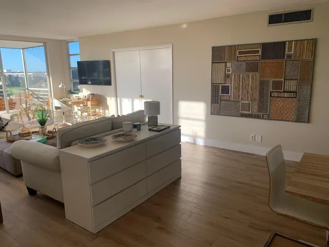 a living room with furniture and flat screen tv