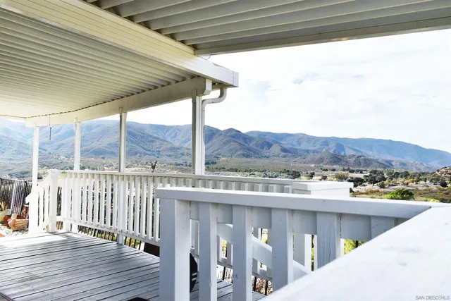 a balcony with an outdoor space