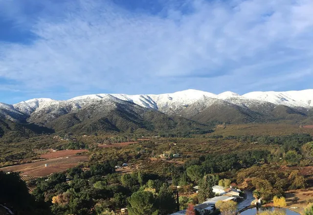 a view of a lake with mountains in the background