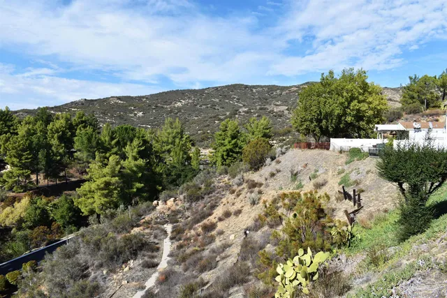 an aerial view of residential house with outdoor space and river
