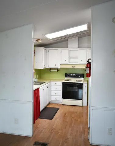 a kitchen with a stove and a microwave