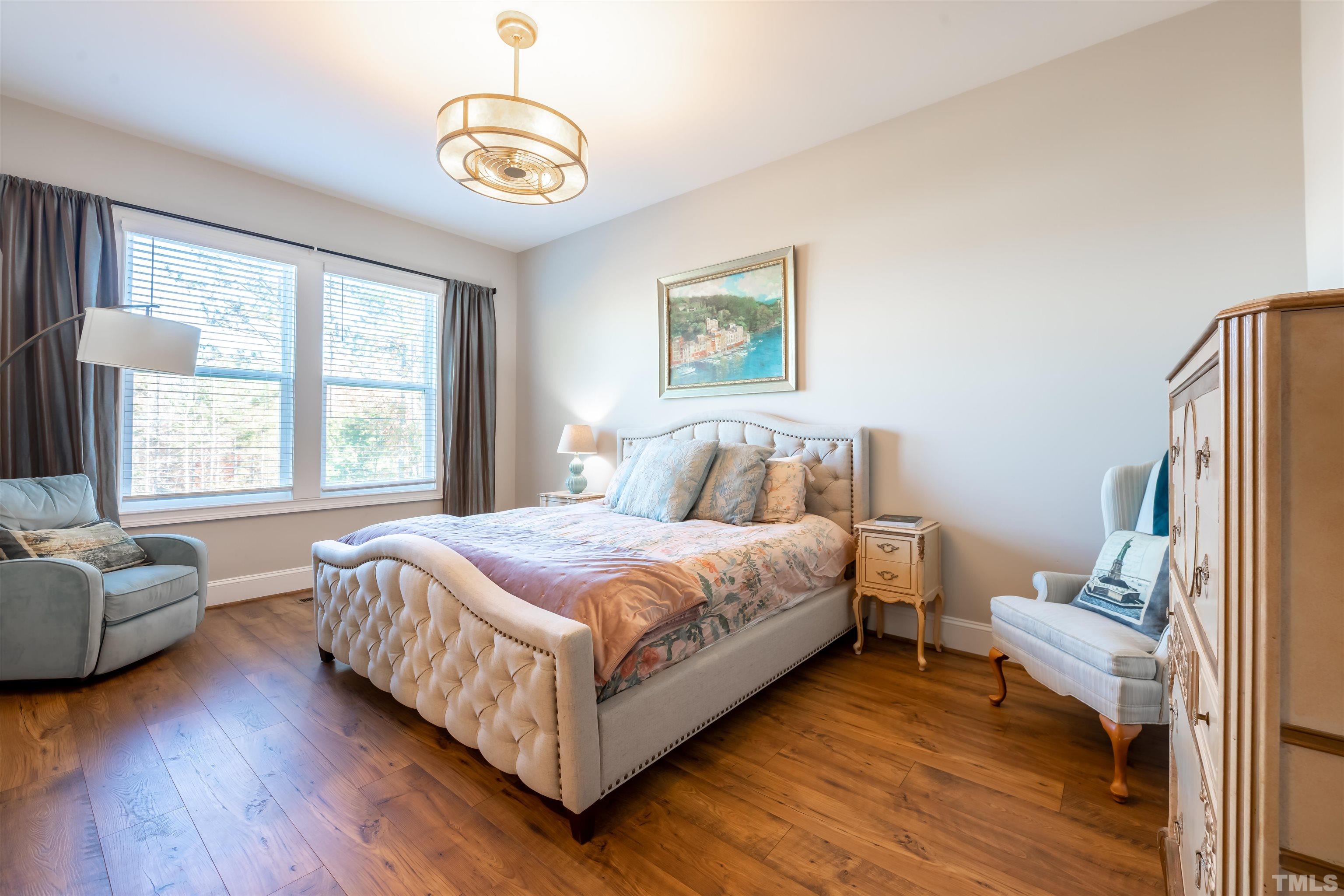 456 Adkins Ridge Road Rolesville, NC 27571 - Photo 11 of 38 a bedroom with a bed and a couch