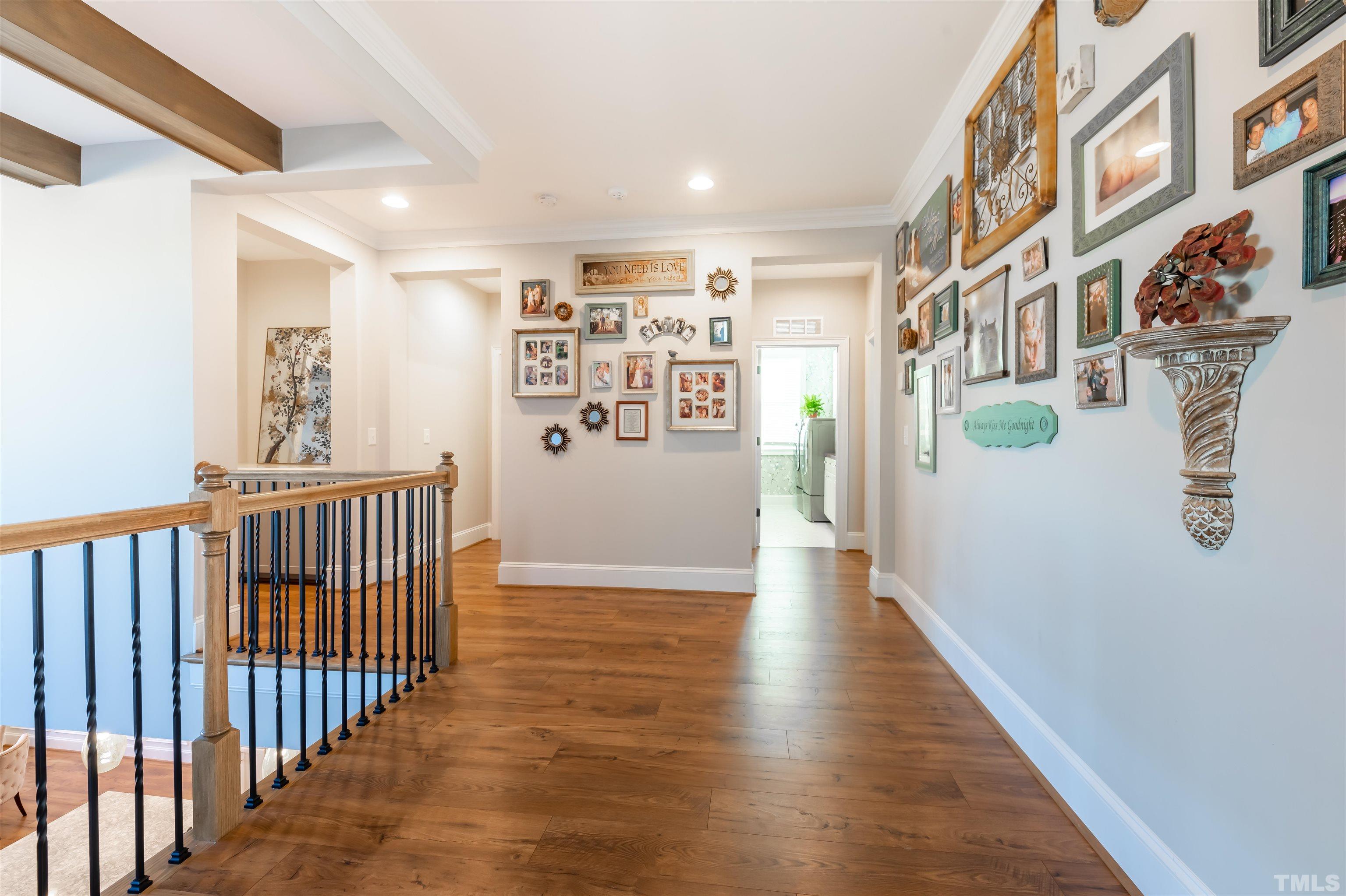 456 Adkins Ridge Road Rolesville, NC 27571 - Photo 13 of 38 a view of a hallway with wooden floor and entryway