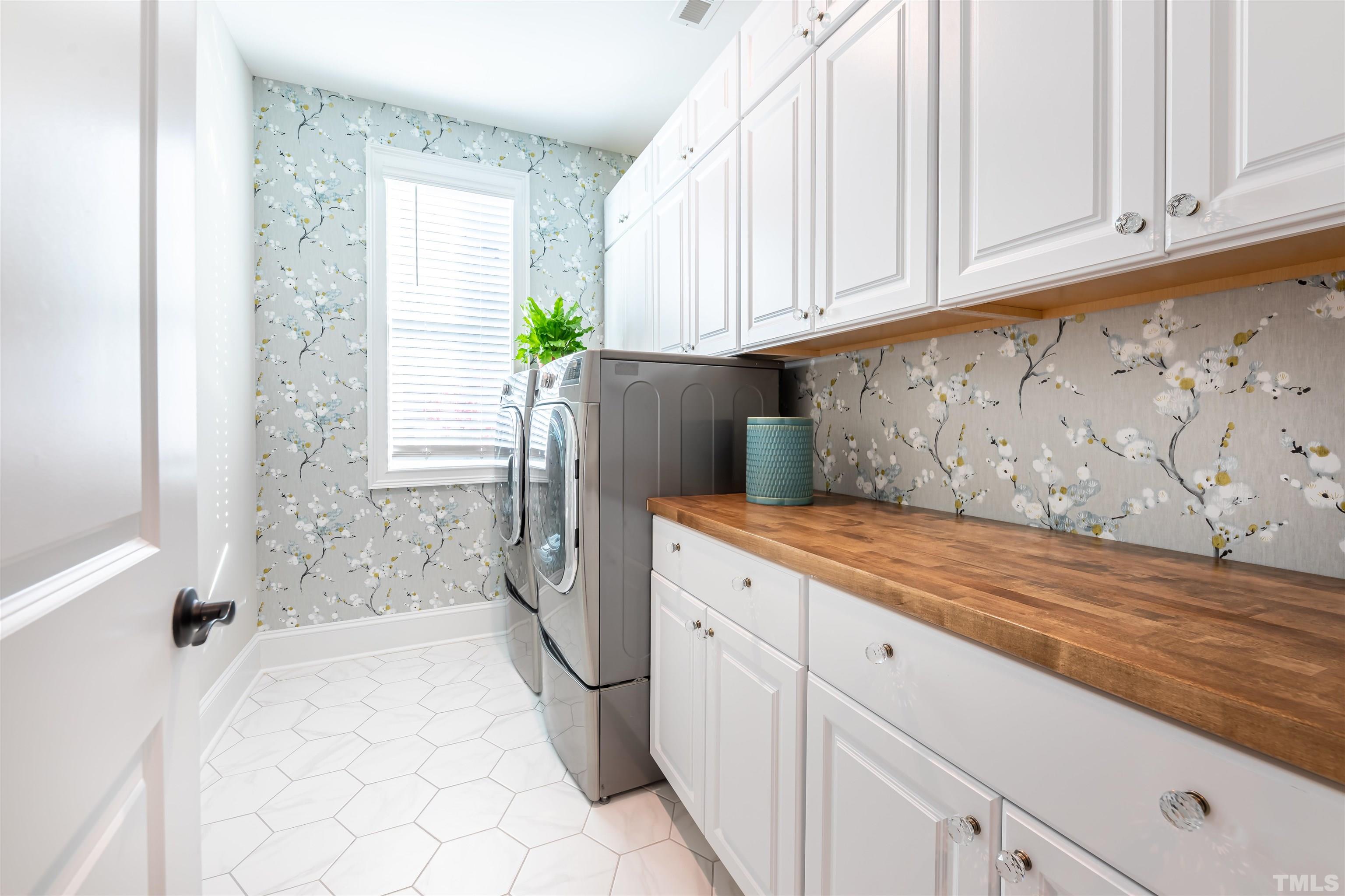 456 Adkins Ridge Road Rolesville, NC 27571 - Photo 17 of 38 a spacious bathroom with a granite countertop sink and a bathtub