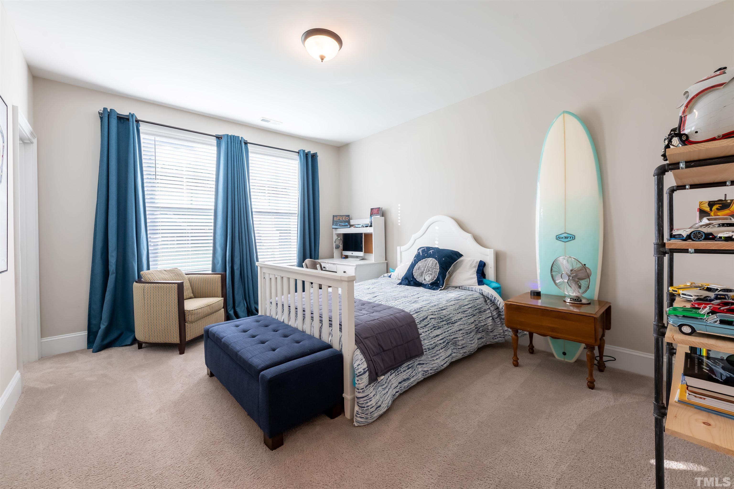 456 Adkins Ridge Road Rolesville, NC 27571 - Photo 20 of 38 a spacious bedroom with a bed and a large window