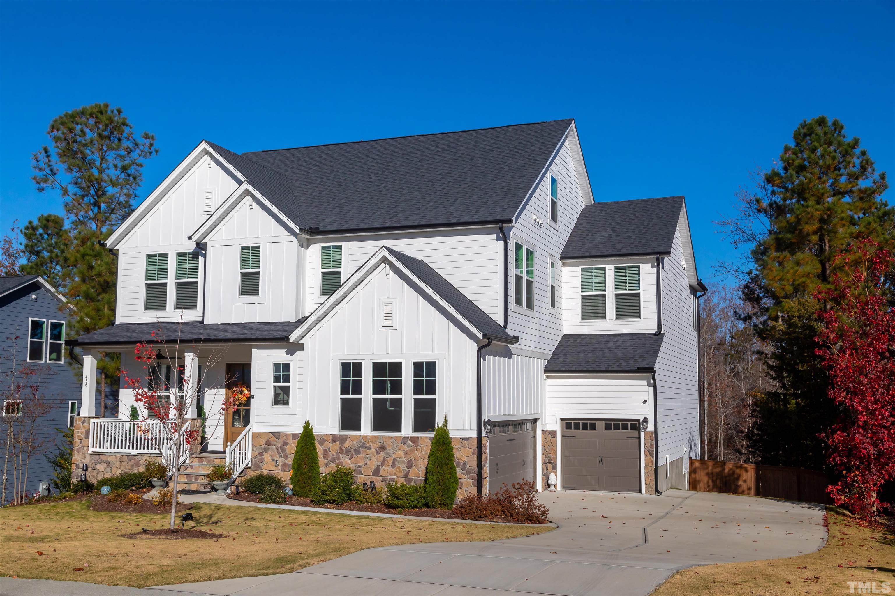 456 Adkins Ridge Road Rolesville, NC 27571 - Photo 3 of 38 a front view of a house with garden