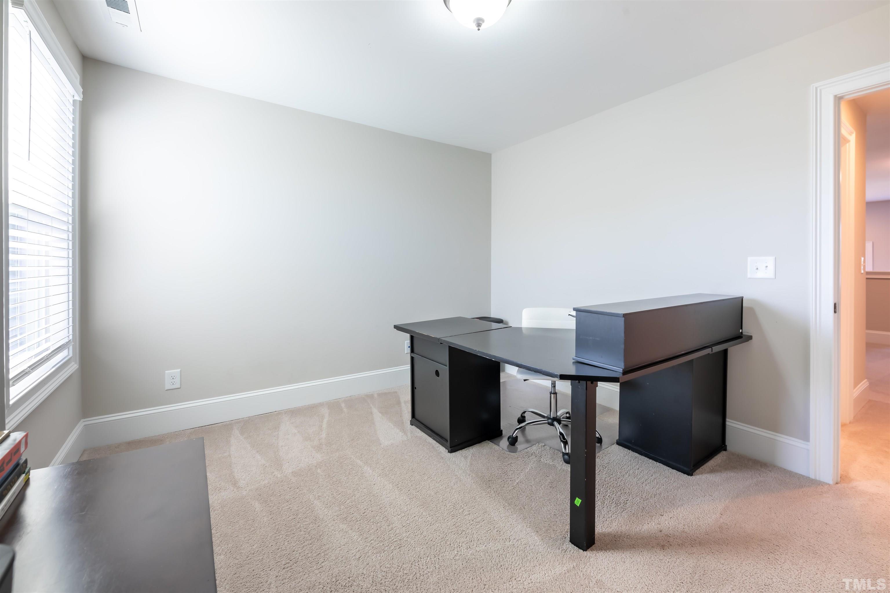 456 Adkins Ridge Road Rolesville, NC 27571 - Photo 25 of 38 a view of an empty room and window