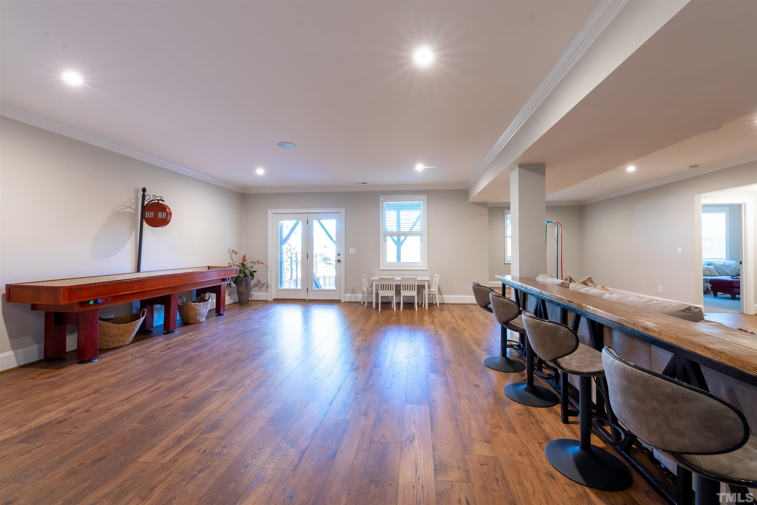 456 Adkins Ridge Road Rolesville, NC 27571 - Photo 28 of 38 a living room with furniture and a wooden floor