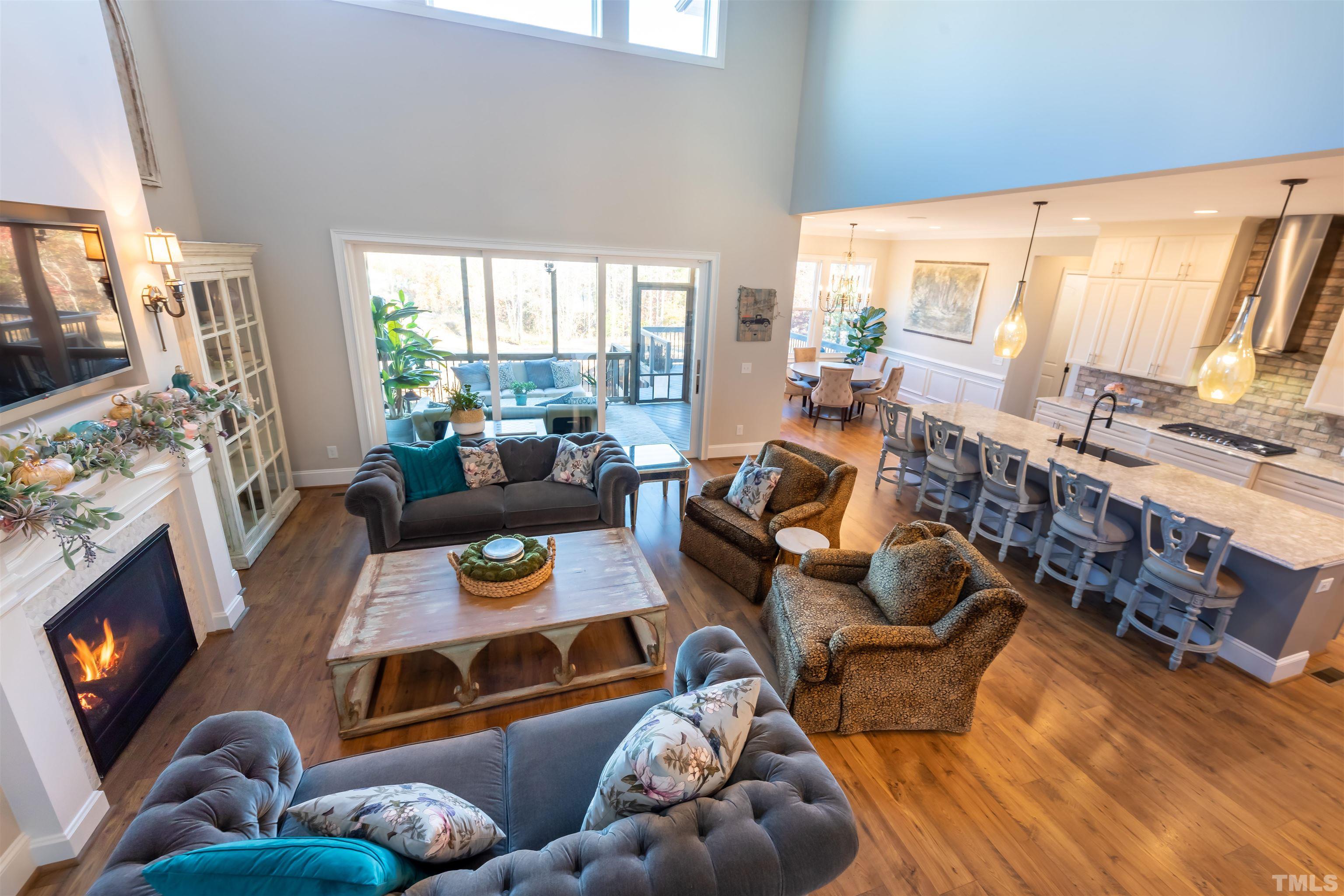 456 Adkins Ridge Road Rolesville, NC 27571 - Photo 4 of 38 a living room with furniture and a flat screen tv