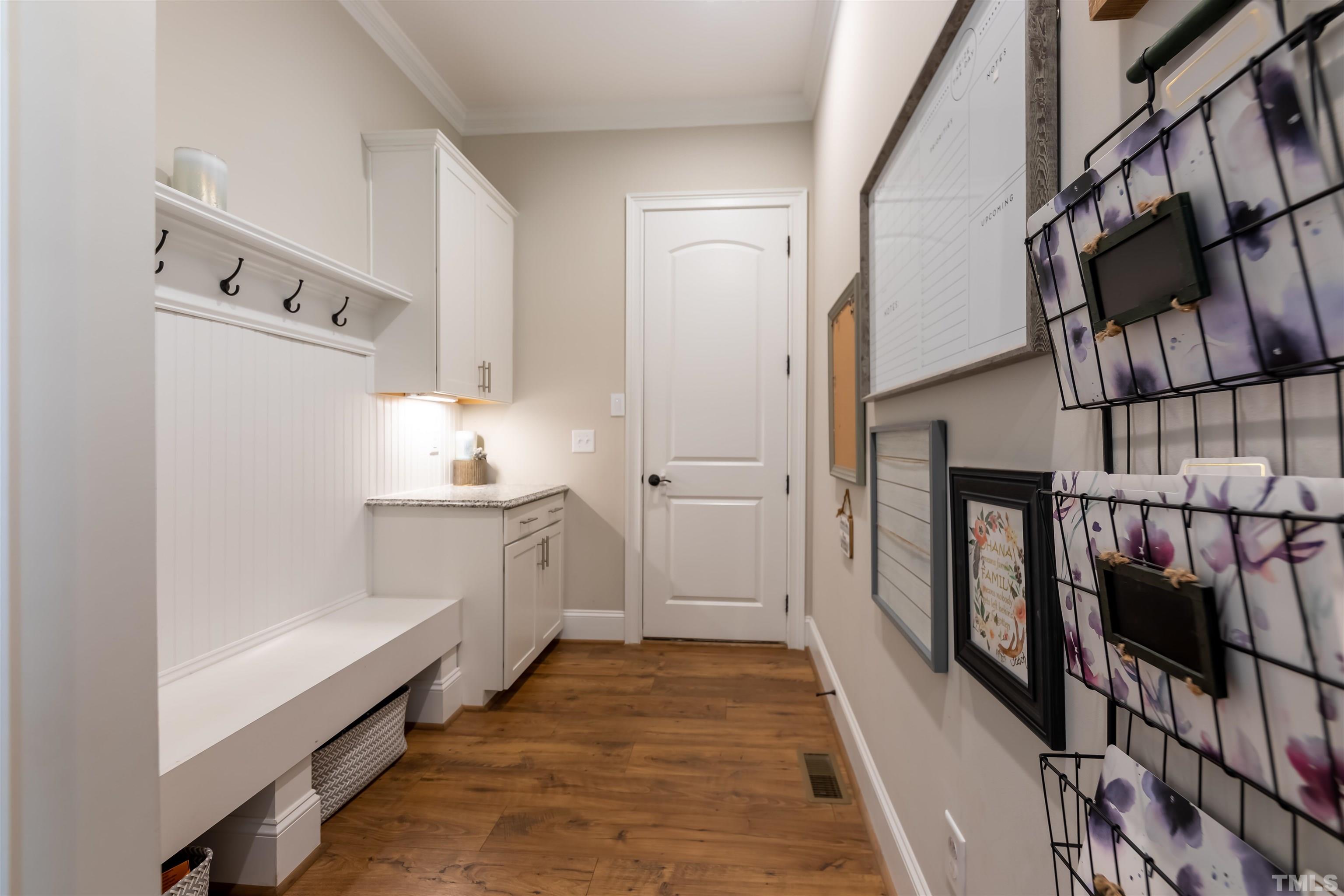 456 Adkins Ridge Road Rolesville, NC 27571 - Photo 32 of 38 a bathroom with granite countertop a sink and a mirror