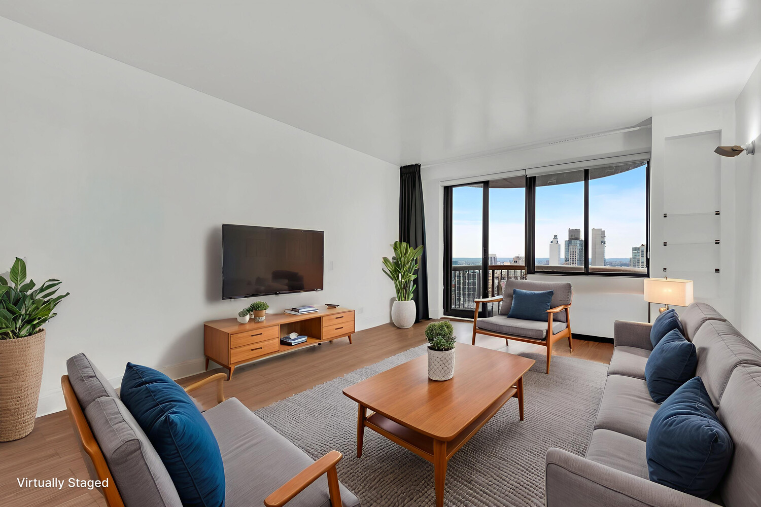 45 East 25th Street, Unit 37A Manhattan, NY 10010 - Photo 12 of 13 a living room with furniture and a flat screen tv