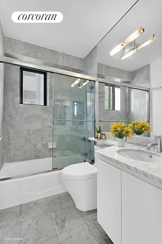 a kitchen with appliances a sink and cabinets