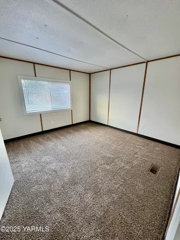 a view of a room with a refrigerator