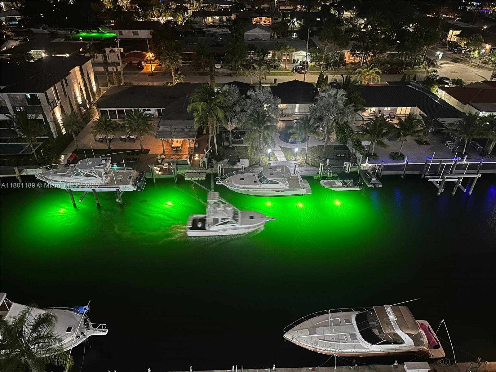 2350 Northeast 135th Street, Unit 1010 North Miami, FL 33181 - Photo 5 of 23 a view of a table and chairs