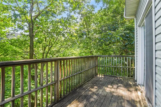 a view of a balcony with a pot