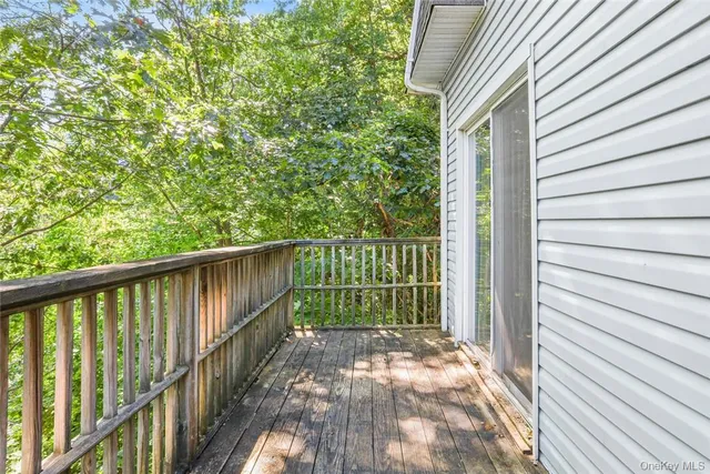 a view of a balcony with wooden floor