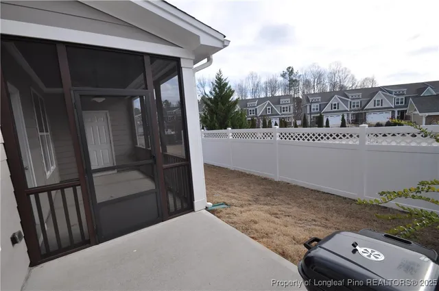 a view of a house with backyard and porch