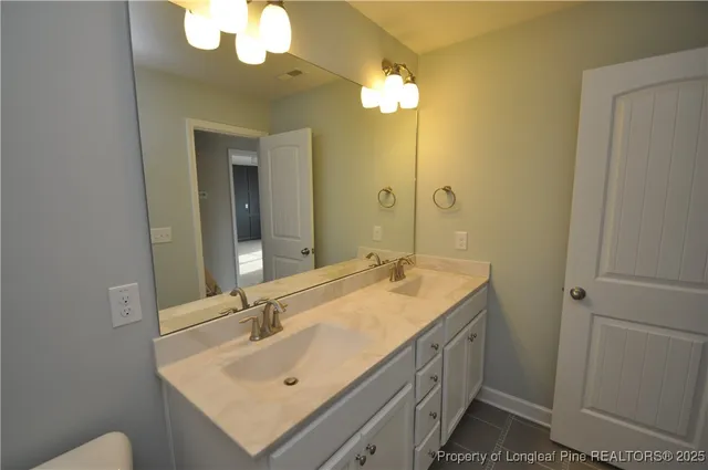 an empty room with windows and mirror