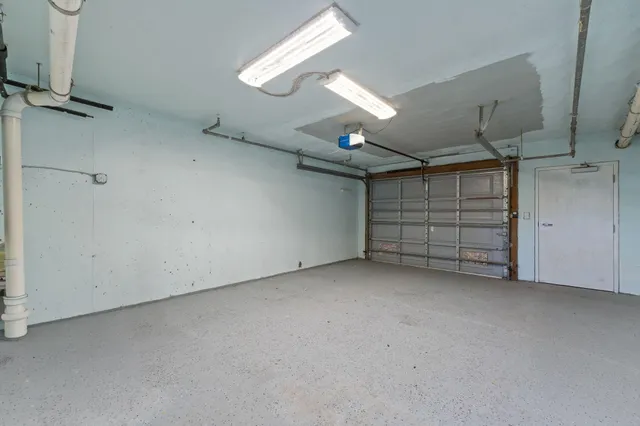 a balcony with furniture and a potted plant
