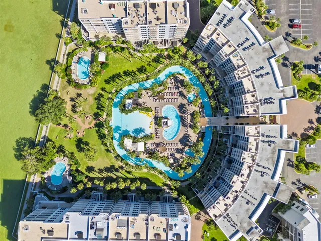 a view of a balcony with wooden floor and lake view