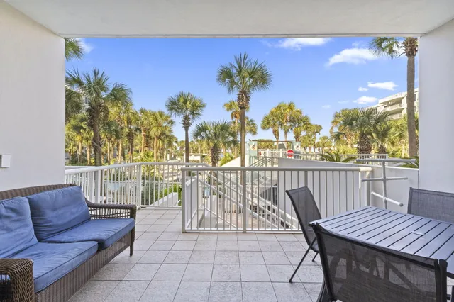 a view of a chairs and table in patio