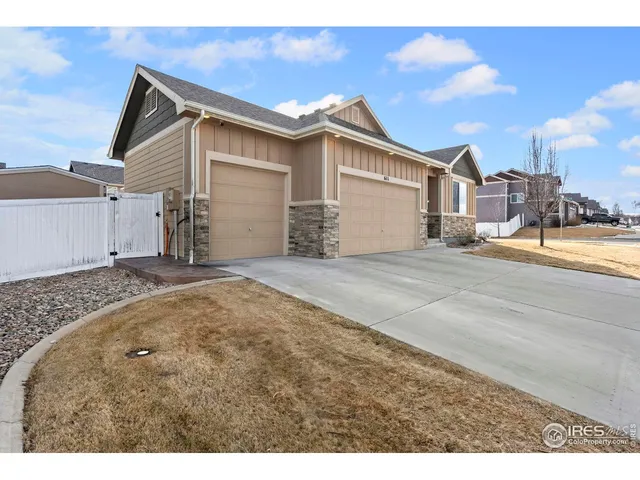 a view of a house with snow on the road