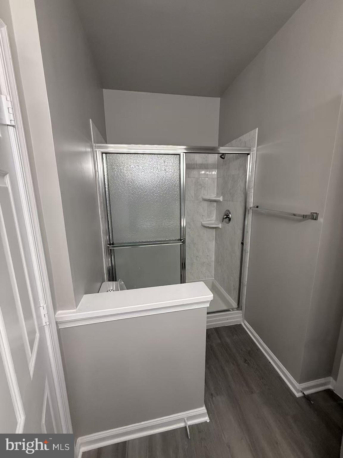 4400 Silverbrook Lane, Unit F003 Owings Mills, MD 21117 - Photo 14 of 17 a bathroom with a shower and toilet