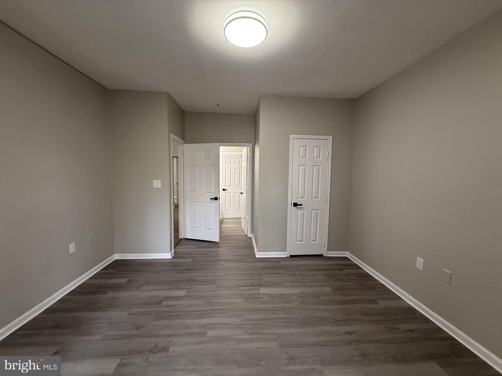 4400 Silverbrook Lane, Unit F003 Owings Mills, MD 21117 - Photo 9 of 17 wooden floor in an empty room with wooden floor