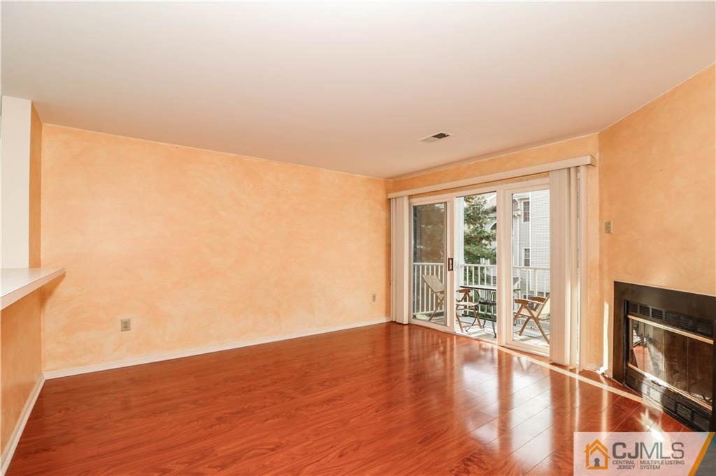 825 Edpas Road, Unit 825 New Brunswick, NJ 08901 - Photo 14 of 25 a view of livingroom with furniture and wooden floor