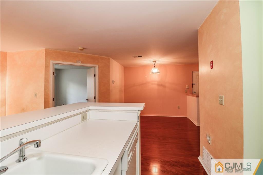 825 Edpas Road, Unit 825 New Brunswick, NJ 08901 - Photo 7 of 25 a bathroom with a sink and a large mirror