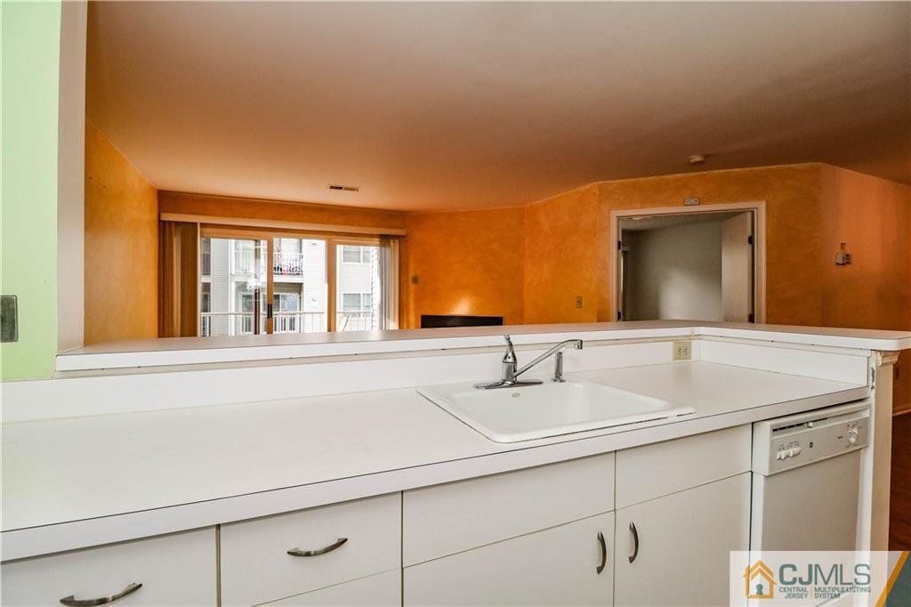 825 Edpas Road, Unit 825 New Brunswick, NJ 08901 - Photo 8 of 25 a bathroom with a sink and a mirror