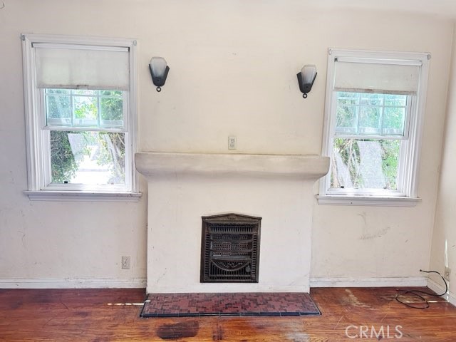 9700 Mayne Street Bellflower, CA 90706 - Photo 3 of 8 a view of an empty room with a window and wooden floor