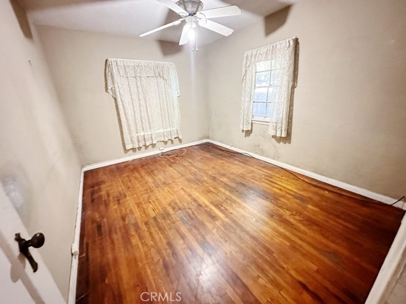 9700 Mayne Street Bellflower, CA 90706 - Photo 5 of 8 an empty room with windows