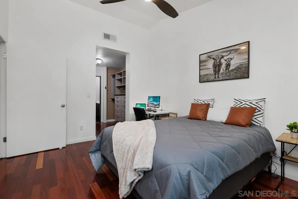 1784 Pala Lake Drive Fallbrook, CA 92028 - Photo 11 of 31 a bedroom with a bed and a wooden floor