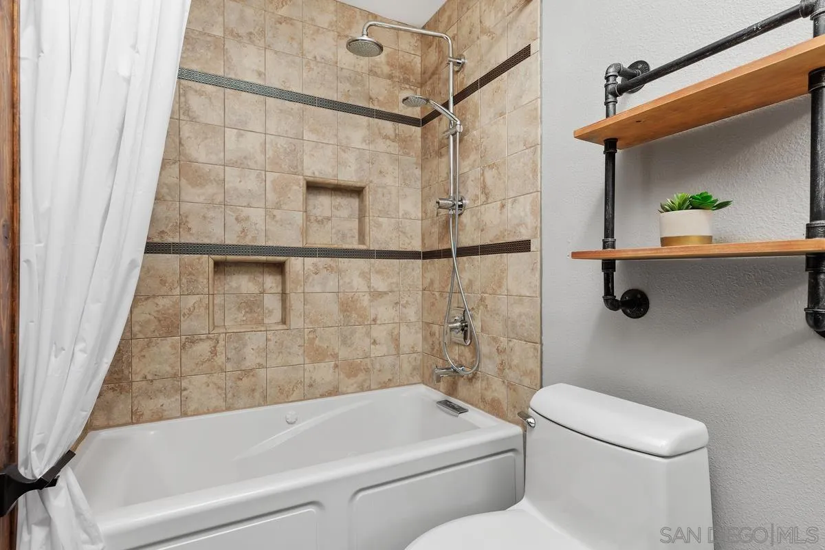 1784 Pala Lake Drive Fallbrook, CA 92028 - Photo 14 of 31 a bathroom with a toilet and a shower