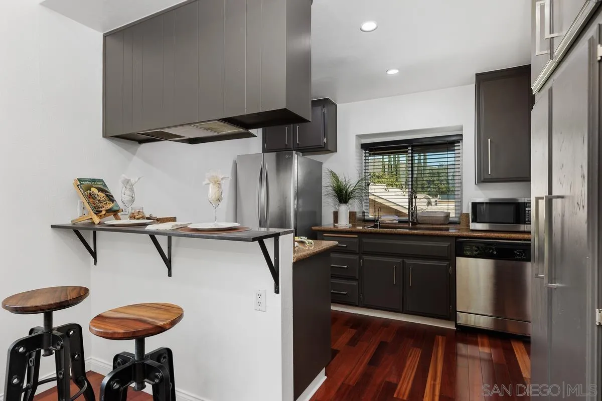 1784 Pala Lake Drive Fallbrook, CA 92028 - Photo 5 of 31 a kitchen with stainless steel appliances a sink and a refrigerator