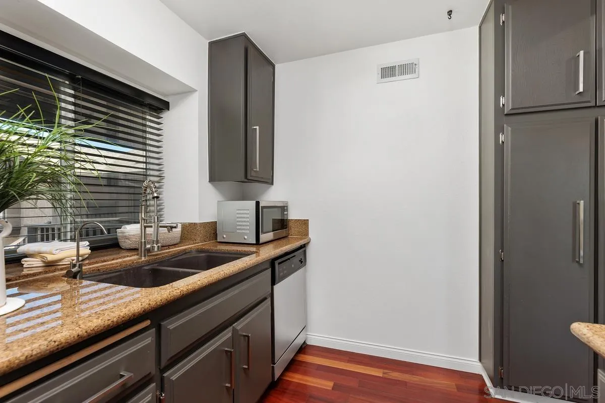 1784 Pala Lake Drive Fallbrook, CA 92028 - Photo 8 of 31 a kitchen with a sink and cabinets