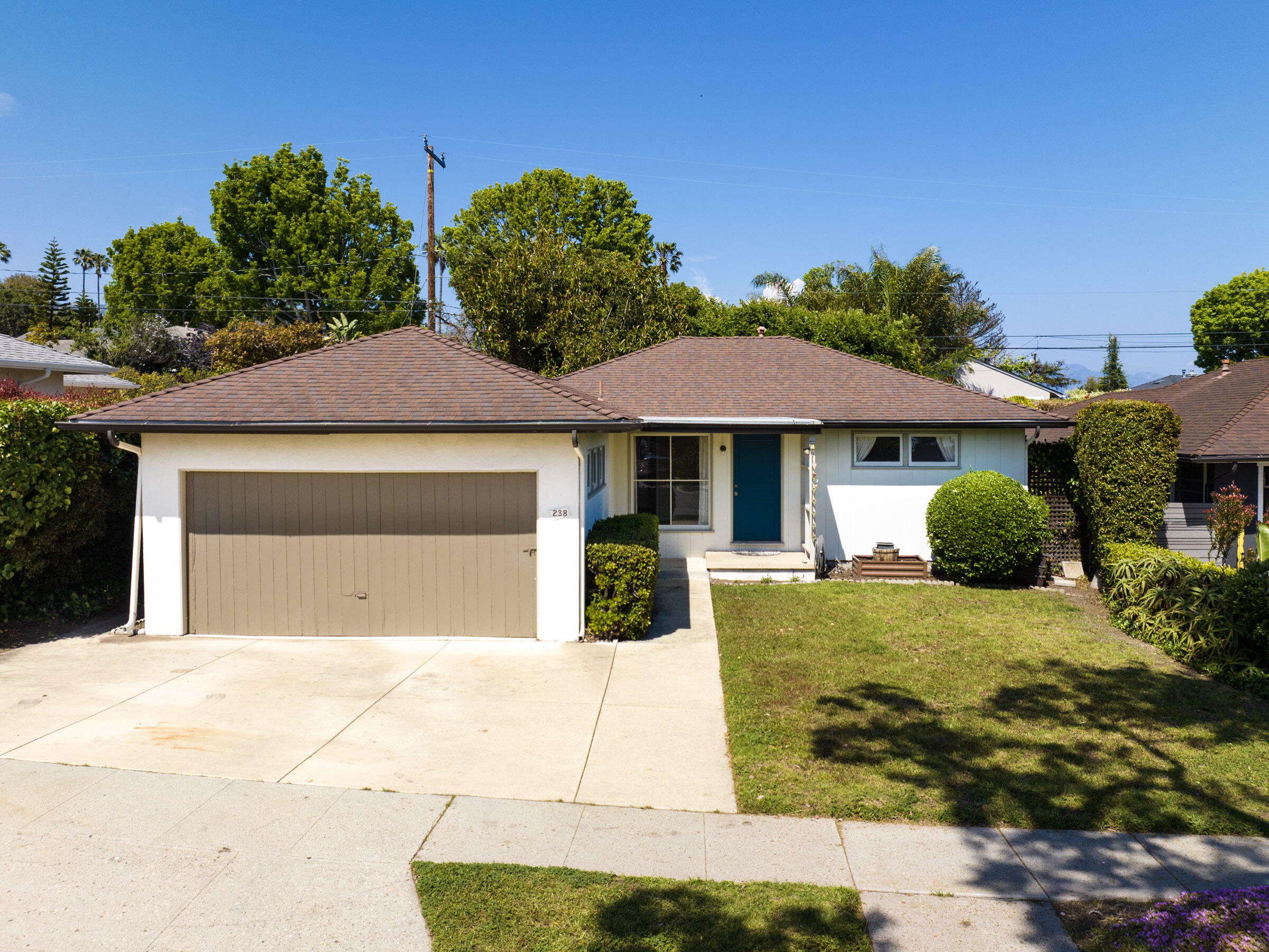 238 San Rafael Avenue Santa Barbara, CA 93109 - Photo 3 of 13 a front view of a house with garden
