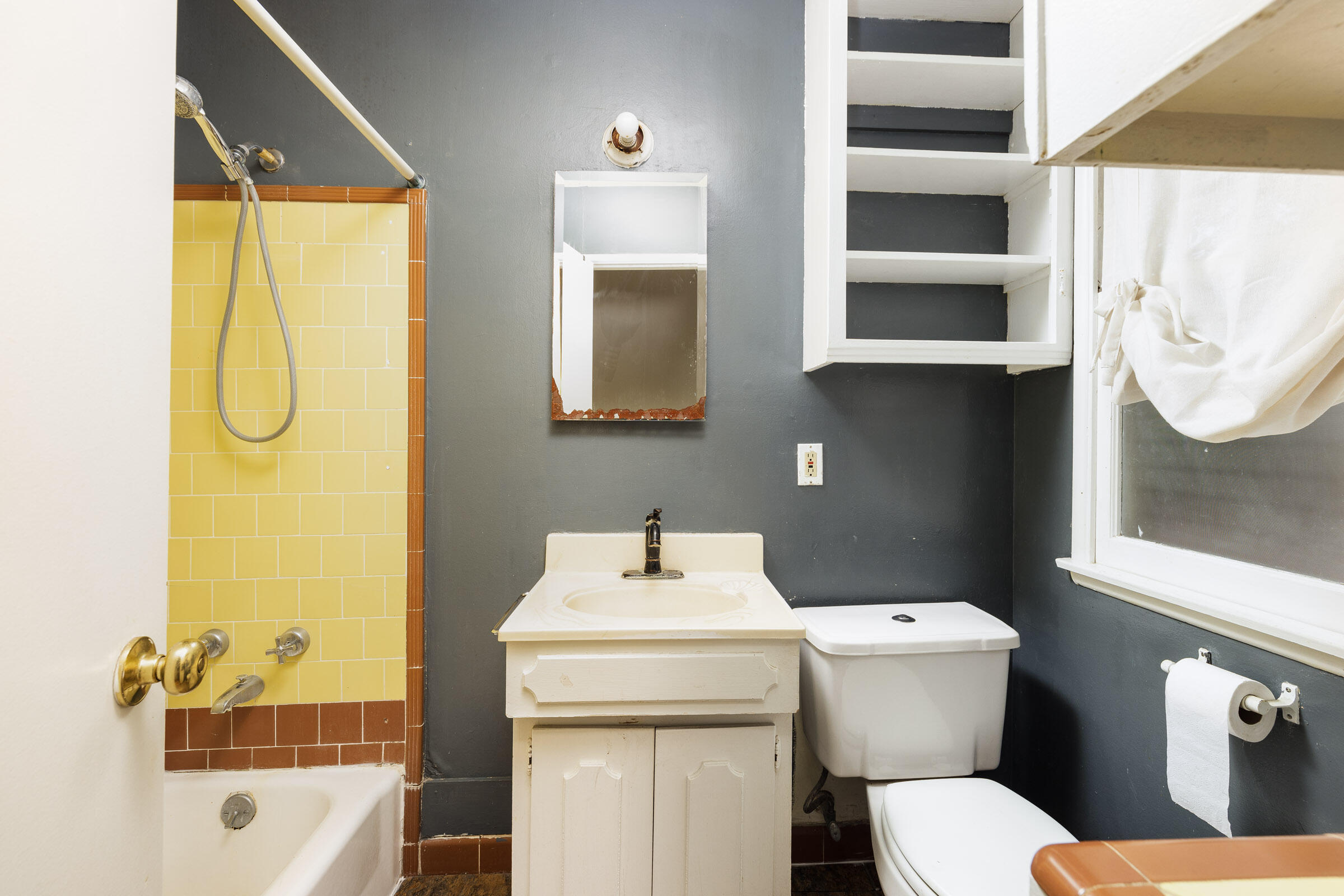238 San Rafael Avenue Santa Barbara, CA 93109 - Photo 10 of 13 a bathroom with a sink toilet and shower