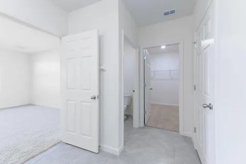 an empty room with closet area