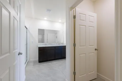 a bathroom with a granite countertop sink a vanity and a mirror