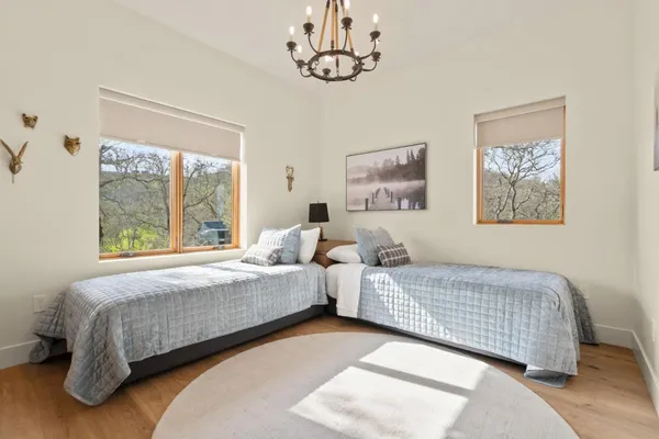 a very nice looking dining room with a table chairs and a kitchen view