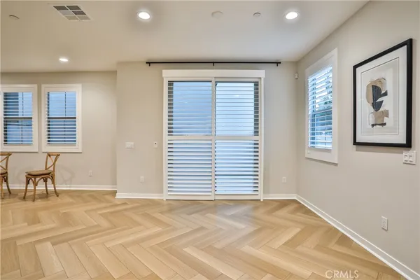 a view of a livingroom with an empty space and a window
