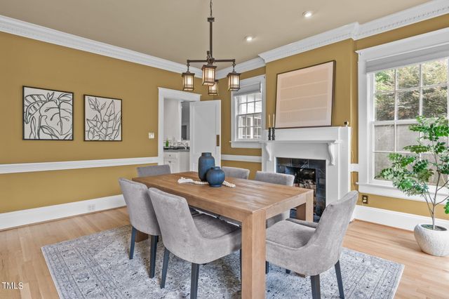 a kitchen with stainless steel appliances granite countertop a refrigerator a oven a sink a stove and white cabinets