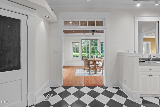 a dining room with furniture and wooden floor