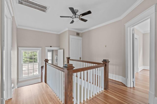 a kitchen with a sink cabinets and a window