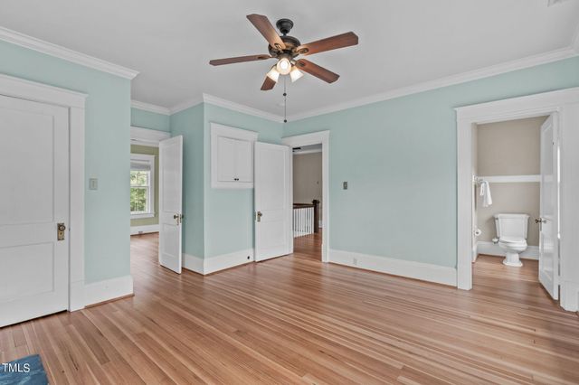 a bathroom with a granite countertop sink a mirror and a bathtub