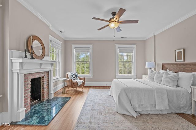 a view of backyard of house with green space